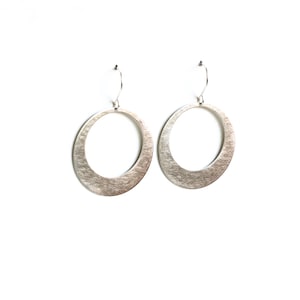 Modern silver hoop earrings, sleek design in crescent moon shape sturdy and lightweight design for everyday wear - "Silver Lunar Hoops"