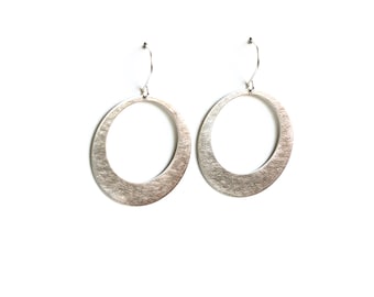 Modern silver hoop earrings, sleek design in crescent moon shape sturdy and lightweight design for everyday wear - "Silver Lunar Hoops"