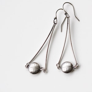 Sleek lightweight sterling earrings with a focal point handmade silver bead securely nestled between silver twigs - "Mezzo Earrings"