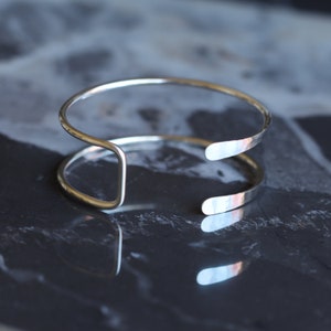 Silver wire cuff, streamlined sterling silver bracelet handmade of sturdy wire formed into a prong shape Small Hammered Tail Cuff image 4