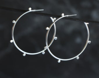 Edgy sterling silver hoop earrings in a contemporary design and matte finish embellished with silver balls - "Compass Hoop earrings"