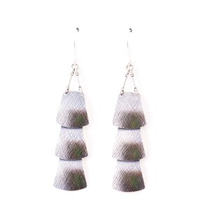 Sterling silver veil earrings of three dramatically connected trapezoid shapes each of which is textured and domed Drape Earrings image 5