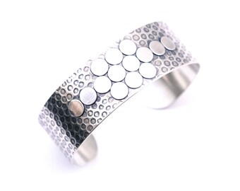 Recycled silver cuff with a playful design of light and dark circles in a multidimensional and oxidized arrangement - "Adagio Cuff"