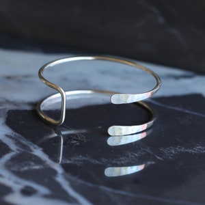 Silver wire cuff, streamlined sterling silver bracelet handmade of sturdy wire formed into a prong shape Small Hammered Tail Cuff image 8