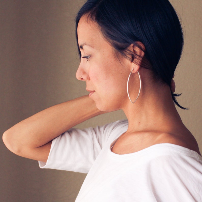 Sturdy lightweight sterling silver hoops designed to stand out with its modern leaf like shape and larger size Porter Hoop Earrings image 2