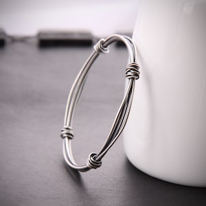 Modern silver bangle with a sleek and edgy charcoal finish handcrafted with different gauges of sterling wire - "Bundle Hoop Bracelet"