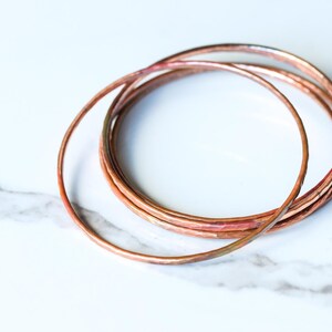 Set of five hammered copper bracelets formed and heat treated for a unique modern look and splash of fall colors - "Desert Bangles - Copper" image 5