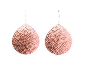 Eye-catching dangle copper earrings with a hammered bubble pattern texture on a sleek teardrop shape - "Juno Earrings - Copper"