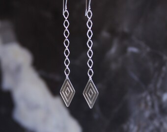 Long dangle earrings with a patterned geometric arrow shape on an etched chain, lightweight design comfortable to wear - "Arrow Earrings"