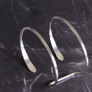 Modern silver cuff bracelet handmade of sturdy 10 gauge sterling silver wire formed into a sleek prong shape Large Hammered Tail Cuff image 7