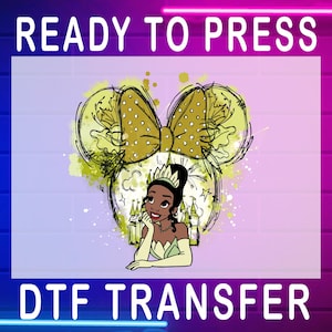 May include: A DTF transfer featuring a sketch of a Minnie Mouse head with a bow and a princess. The bow is gold with white polka dots. The princess is wearing a crown and a green dress. The words "READY TO PRESS" and "DTF TRANSFER" are at the top and bottom.