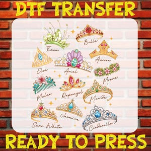 May include: DTF transfer featuring illustrations of various princess tiaras, including Elsa, Ariel, and Cinderella. The tiaras are in gold, silver, and jewel tones, with names like Belle, Aurora, and Moana. The text "DTF TRANSFER" and "READY TO PRESS" are at the top and bottom.