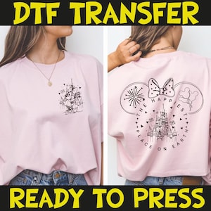 May include: Pink t-shirt with a black and white graphic of a Disney castle and Minnie Mouse on the front. The back of the shirt features a Mickey Mouse ear design with fireworks, a bow, and the text "The Happiest Place on Earth."