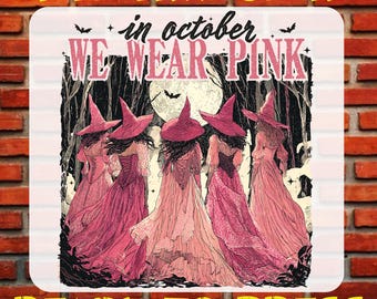 May include: A DTF transfer sheet featuring the text "DTF TRANSFER" at the top and "READY TO PRESS" at the bottom. The central graphic shows five figures in pink dresses and pointed hats standing before a full moon, with the text "in october WE WEAR PINK" printed above them.