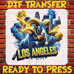 May include: DTF TRANSFER graphic featuring a blue ram holding a football, with the text "LOS ANGELES" in gold. The design includes a cityscape and the words "READY TO PRESS" in yellow.