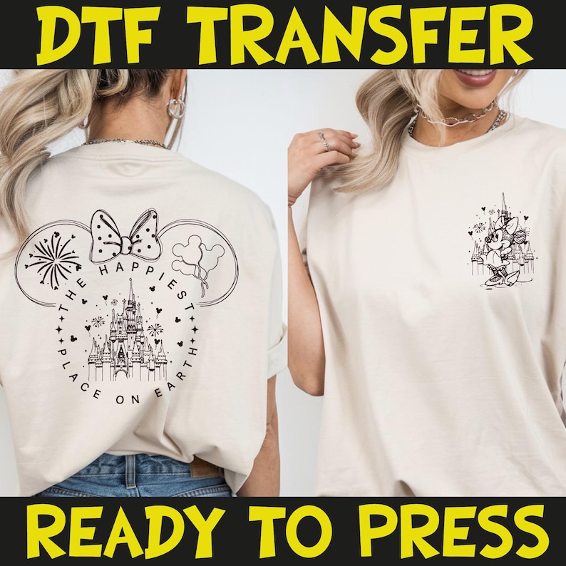 May include: Cream-colored t-shirt with a black graphic of a castle, fireworks, and Minnie Mouse ears. The text "THE HAPPIEST PLACE ON EARTH" is printed on the back. The words "DTF TRANSFER" and "READY TO PRESS" are printed in yellow.