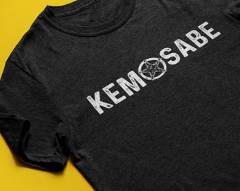 May include: A dark gray t-shirt with a white graphic print of the text "KEMOSABE" with a five-pointed star in the middle of the word.