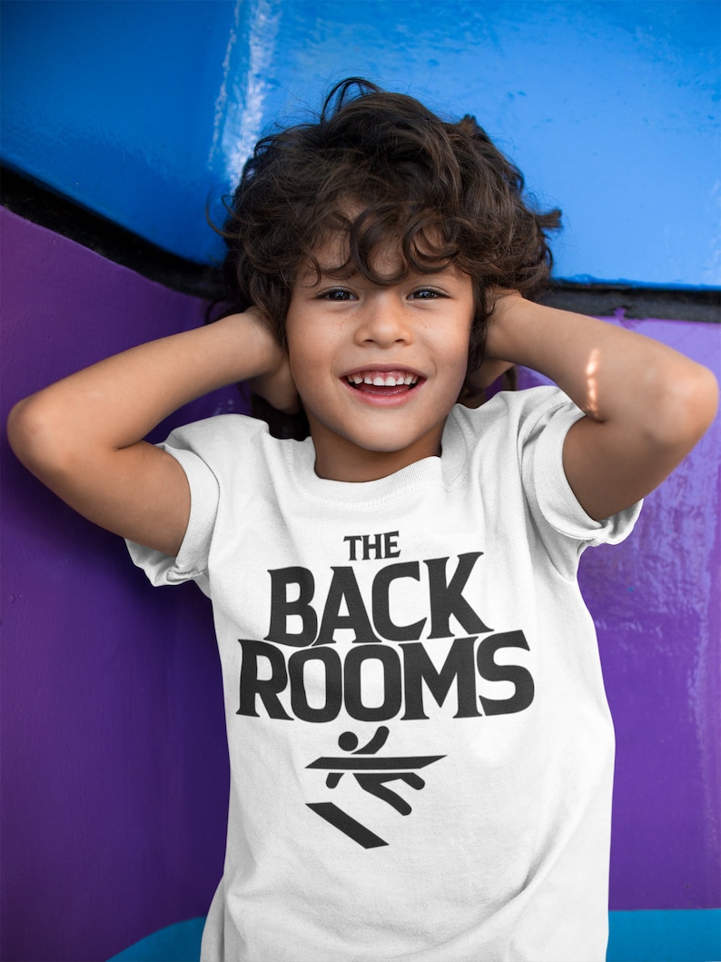 May include: A white t-shirt with a black graphic that says "THE BACK ROOMS" with a stick figure running on a black and white striped floor.