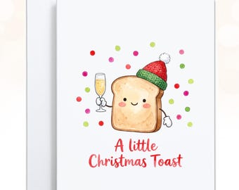 May include: A white greeting card featuring a watercolor illustration of a smiling piece of toast wearing a red and green Santa hat. The toast holds a champagne flute, surrounded by colorful confetti dots, with the text A little Christmas Toast.