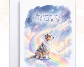 May include: A greeting card featuring a watercolor illustration of a blue merle Australian Shepherd sitting on a rainbow bridge amidst pastel clouds and a starry night sky. The text reads, May their memory be etched into the Stars.