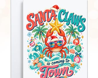 May include: A greeting card featuring a red crab wearing a Santa hat and sunglasses, holding a yellow star. The text reads SANTA CLAWS is coming to TOWN. The design includes palm trees, ocean waves, seashells, and colorful Christmas ornaments.