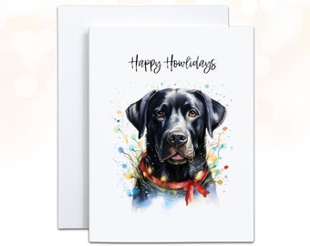 May include: A greeting card featuring a watercolor illustration of a black Labrador Retriever. The dog is adorned with a red ribbon and festive lights. The text "Happy Howlidays" is written above the dog's head. The card is white with a matching envelope.