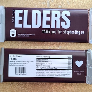 May include: A brown chocolate bar with the words "Elders" in white letters. The bar has a nutrition facts label with the text "Love of Jehovah", "Love of brotherhood", "Willingness to serve", "Spirit of mildness", and "Late nights & self sacrifice". The bar also has the text "Agape Love" and "Net Worth Priceless (Jeremiah 23:4)".
