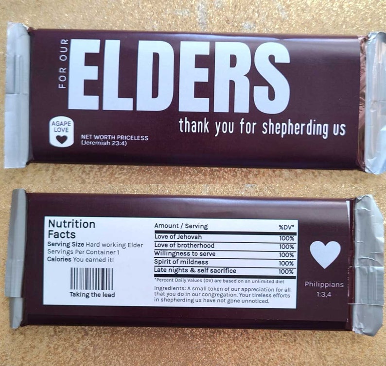 May include: A brown chocolate bar with the words "Elders" in white letters. The bar has a nutrition facts label with the text "Love of Jehovah", "Love of brotherhood", "Willingness to serve", "Spirit of mildness", and "Late nights & self sacrifice". The bar also has the text "Agape Love" and "Net Worth Priceless (Jeremiah 23:4)".