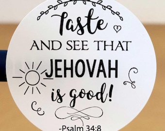 May include: White round sticker with black text that reads "Taste and see that Jehovah is good! -Psalm 34:8". The sticker has a sun, a heart, and a swirl design.