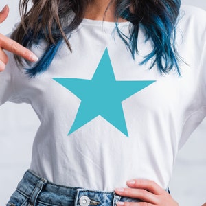 May include: A white t-shirt with a large turquoise star design.