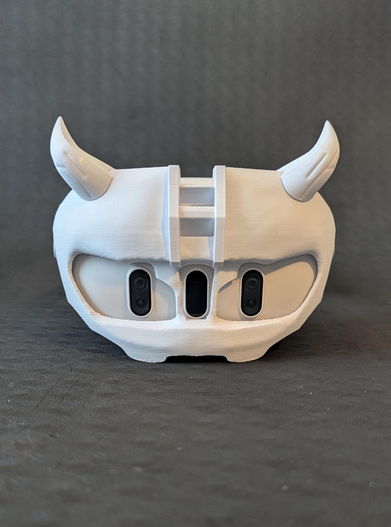 Front view of the upper Cyber Oni headplate in all white over the Meta Quest 3 headset with an elite strap.