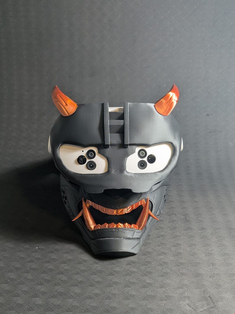 Front view of the full Cyber Oni mask set in black and copper over the Meta Quest 3s headset with an elite strap.