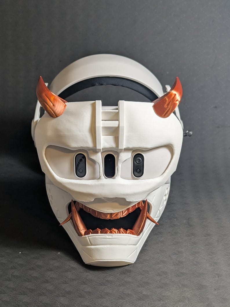 Front view of the full Cyber Oni mask set in white and copper over the Meta Quest 3 headset with a halo strap.