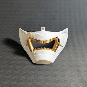 Front view of the lower half of the Cyber Oni mask for the Meta Quest 3/3s in white and gold.