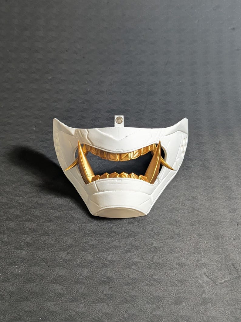 Front view of the lower half of the Cyber Oni mask for the Meta Quest 3/3s in white and gold.