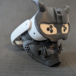 Side view of the full Cyber Oni mask set in all black over the Meta Quest 3s headset with an elite strap.