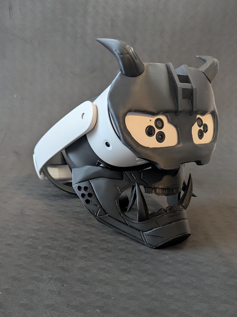 Side view of the full Cyber Oni mask set in all black over the Meta Quest 3s headset with an elite strap.