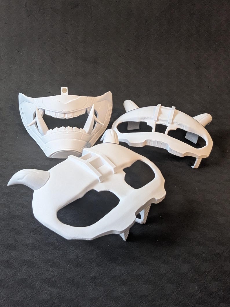 A collection of the different components making up the Cyber Oni mask set for the Quest 3 and Quest 3s