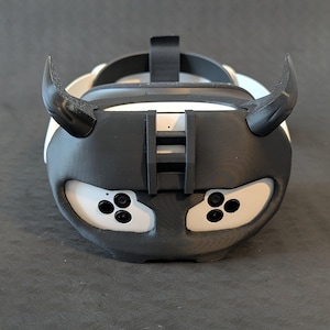 Front view of the upper Cyber Oni headplate in all black over the Meta Quest 3s headset with an elite strap