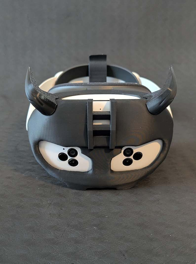 Front view of the upper Cyber Oni headplate in all black over the Meta Quest 3s headset with an elite strap