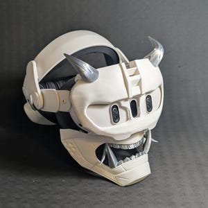 Side view of the full Cyber Oni mask set in white and silver over the Meta Quest 3 headset with a halo strap.