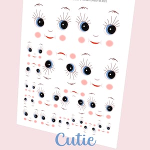 May include: A white printable sheet with multiple doll faces. Each face has blue eyes, long eyelashes, rosy cheeks, and red smiles. The word "Cutie" is in blue script, with "Doll Face Printable Transfer" below.