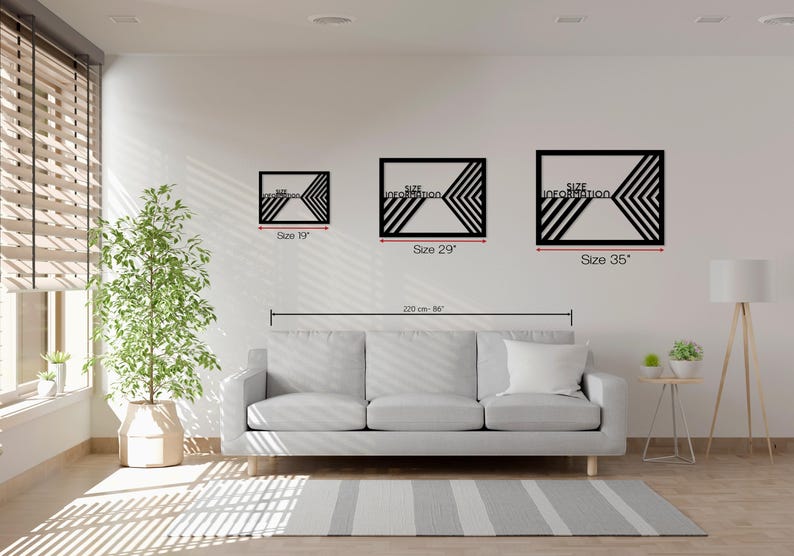 May include: Three black geometric wall art pieces with chevron designs are displayed on a white wall. The sizes are 19 inches, 29 inches, and 35 inches. The text "Size Information" is visible on each piece. A gray sofa and rug are in the foreground.