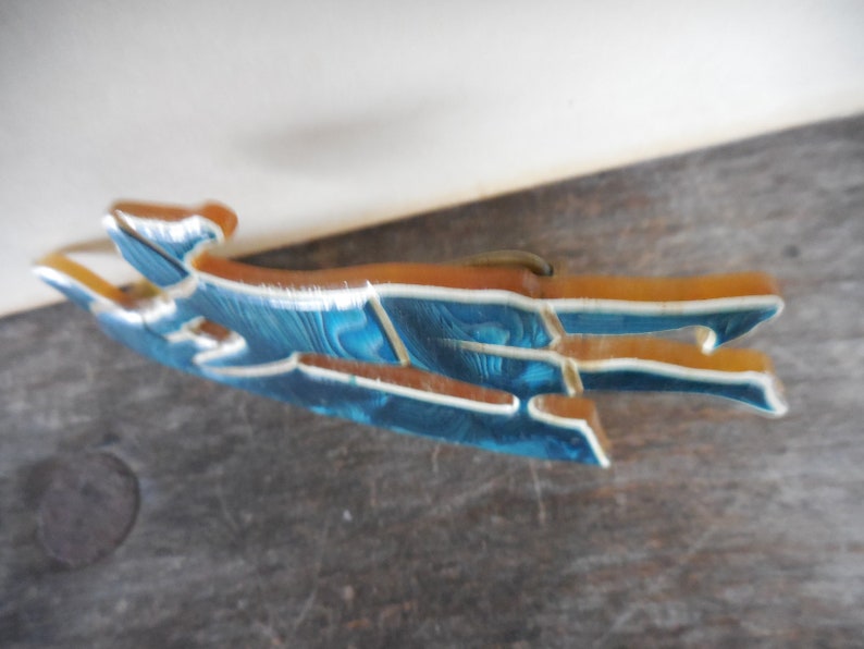 Vintage Unsigned Laminated Celluloid Pin Brooch Sled Sledding Toboggan