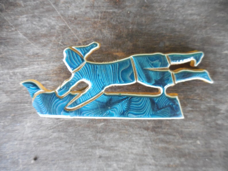 Vintage Unsigned Laminated Celluloid Pin Brooch Sled Sledding Toboggan