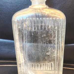Antique glass Jergens lotion ribbed bottle