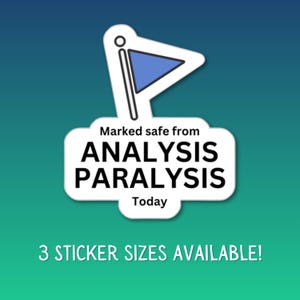 May include: A white sticker with a blue flag graphic and the text "Marked safe from ANALYSIS PARALYSIS Today." The sticker also states "3 STICKER SIZES AVAILABLE!" on a gradient blue and green background.