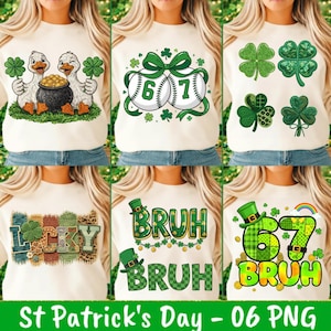 May include: A collection of cream-colored sweatshirts with St. Patrick's Day-themed designs. The designs include ducks with shamrocks and a pot of gold, baseballs with shamrocks, various shamrock arrangements, the word "Lucky", and the word "Bruh" with a leprechaun hat.