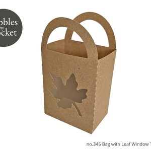 May include: A brown paper bag with a cut-out leaf window. The bag has a handle and says "no. 345 Bag with Leaf Window Template" at the bottom.