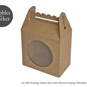 May include: A brown cardboard gable box with a round scalloped window. The box has a handle and is labeled "Pebbles in my Pocket" no. 330 Scallop Gable Box with Round Scallop Window Template.